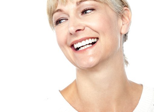facelift patient model in a white shirt smiling