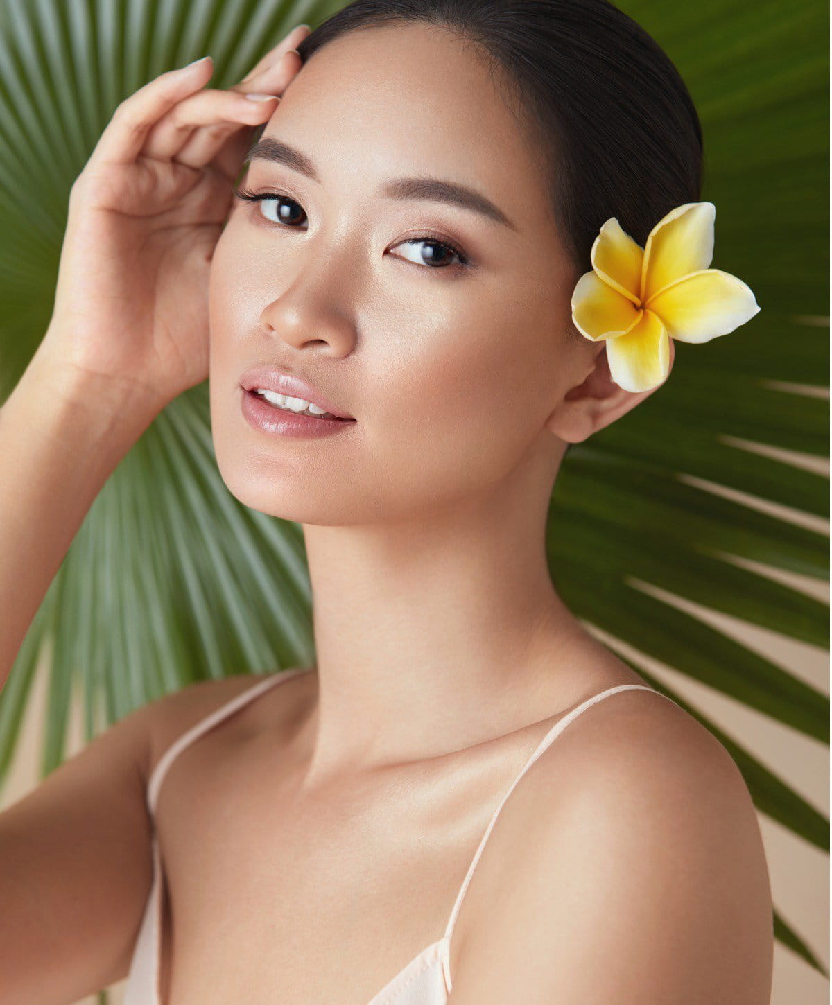 Morpheous8 rf microneedling patient model with a flower behind her ear