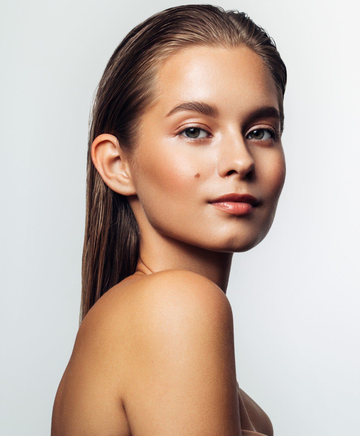 pretty Laser Skin Resurfacing patient model smiling slightly with bare shoulders